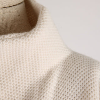 Close-up of a textured knitted jacket on a mannequin