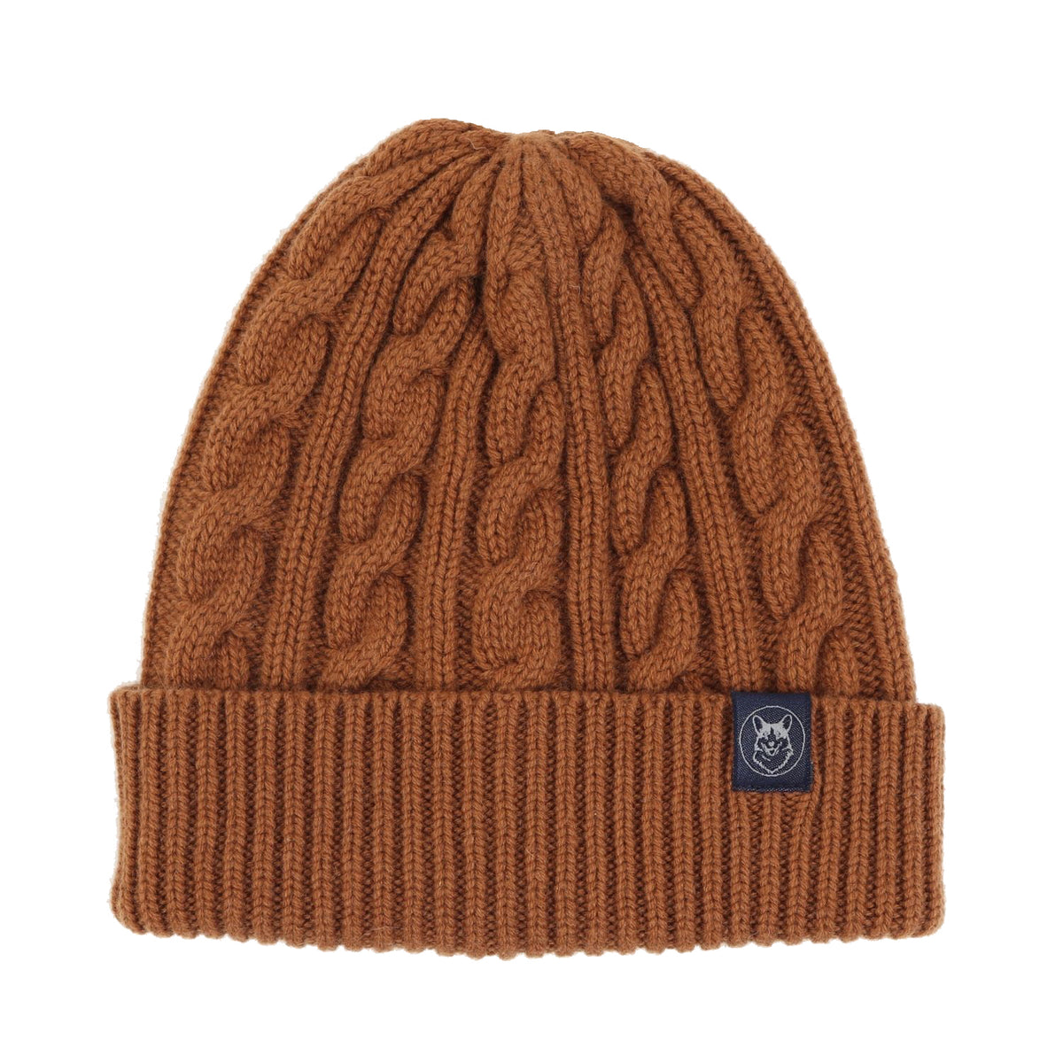 A brown cable-knit beanie with a ribbed cuff and a small black brand patch on the side, shown against a plain white background.