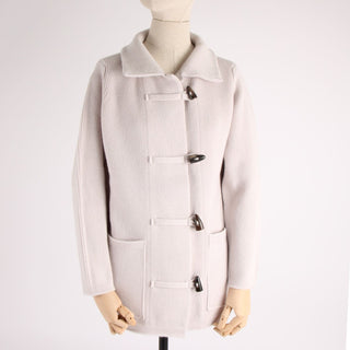 Light gray duffel coat on a mannequin against a white background