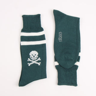 Green socks with skull design and 'corgi' text on a white background