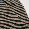 Close-up of a black and beige striped fabric texture
