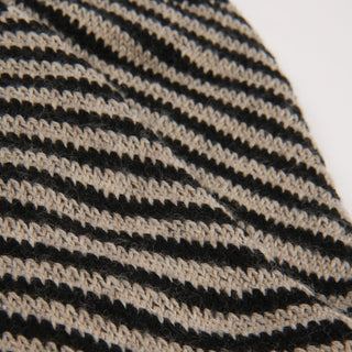Close-up of a black and beige striped fabric texture