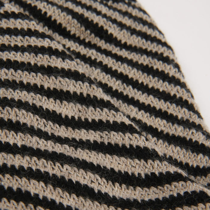 Close-up of a black and beige striped fabric texture
