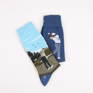 Two socks with golf-themed designs on a white background