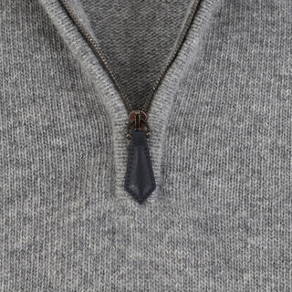 Close-up of a zipper on a gray fabric background