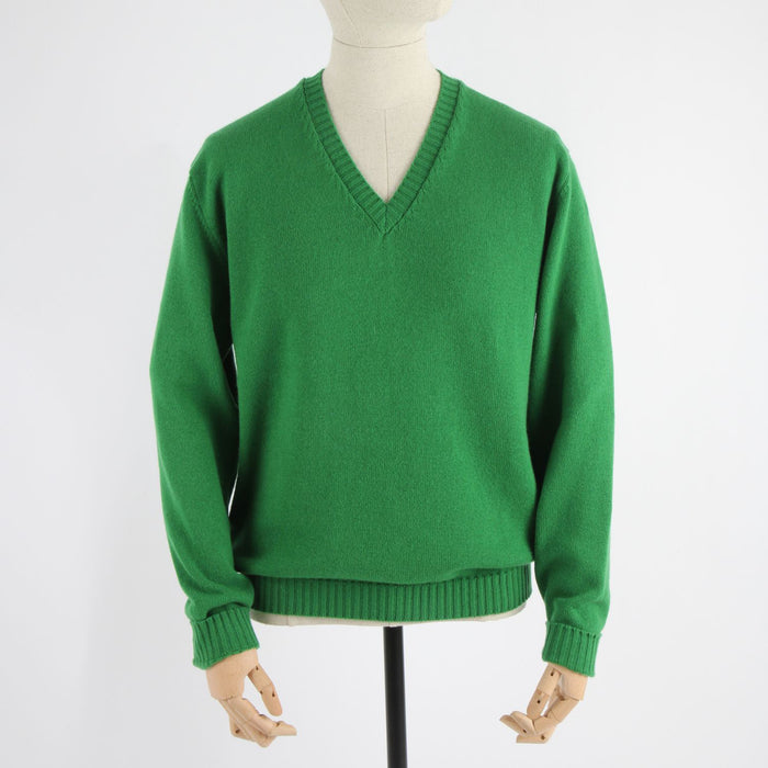 A green men's classic V-neck sweater displayed on a mannequin.