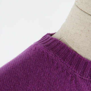 A close up detail of the neckline of the sweater