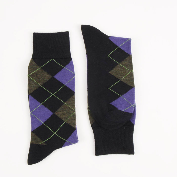 Pair of navy argyle socks with purple and green pattern on a white background