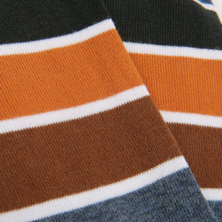 Close-up of striped fabric with orange, brown, white, and blue colors.