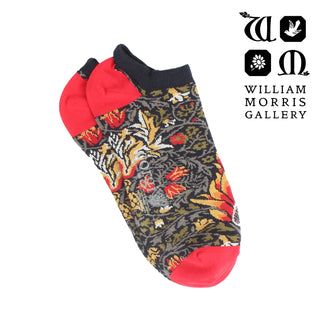 Colorful patterned sock with red accents on a white background, featuring the William Morris Gallery logo.