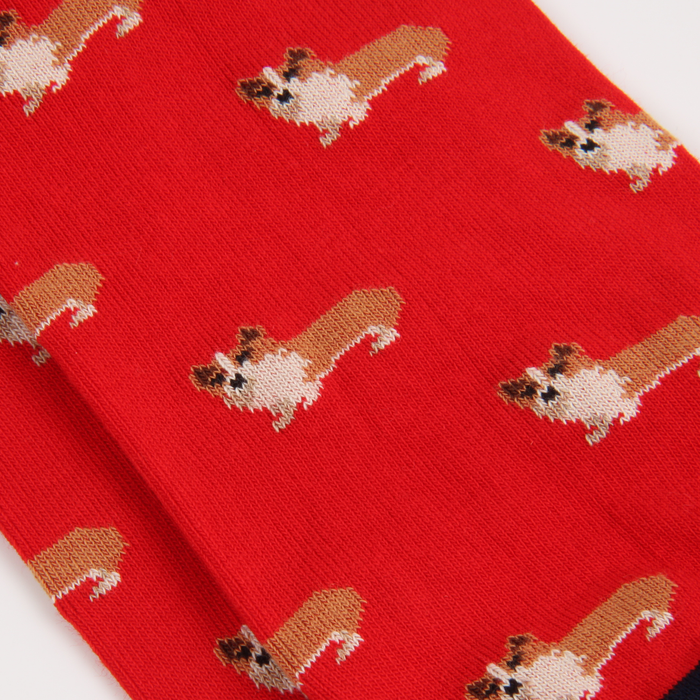 Red fabric with a pattern of small dogs on a white background