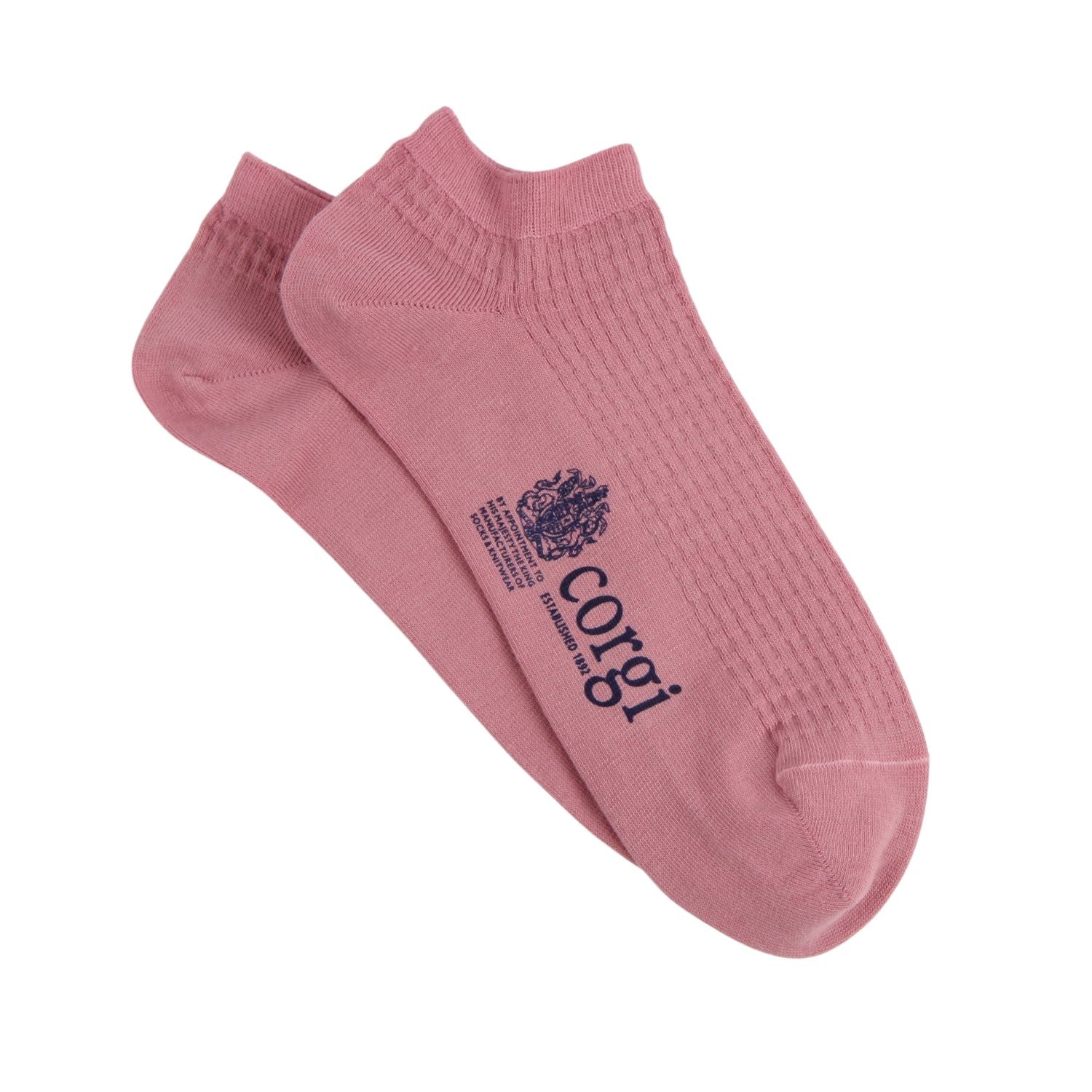 Pink socks with 'corgi' branding on a white background