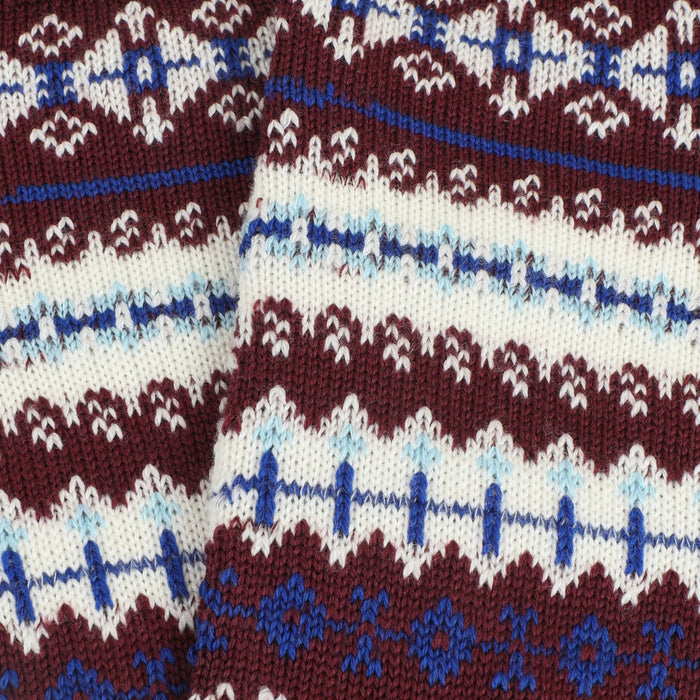 Close-up of patterned fabric with blue, white, and burgundy colours.