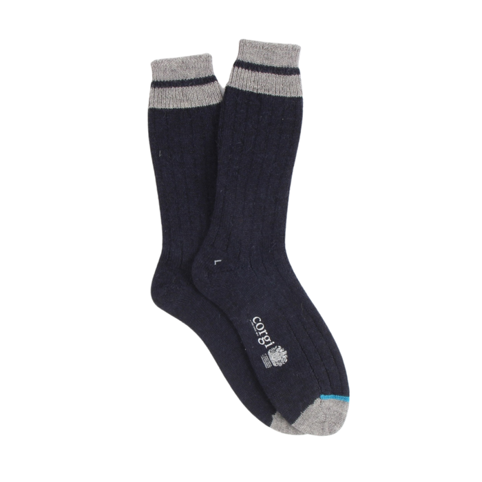 Pair of navy socks with gray cuffs and toes on a white background