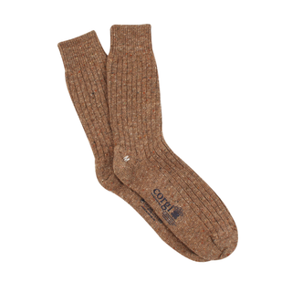 A pair of brown tweed effect wool socks with visible ribbed texture and a brand logo on the ankle.