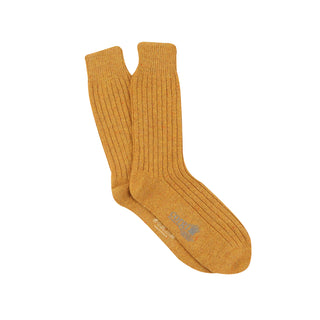 A pair of men's plain ribbed wool socks in a yellow color, featuring a tweed effect and a visible brand tag.