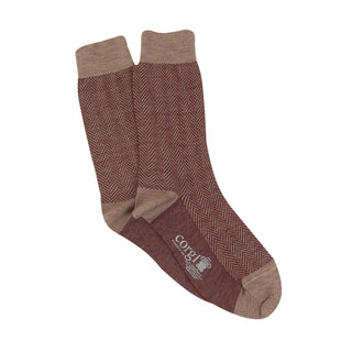 A pair of men's formal herringbone merino wool socks in a neutral colour.