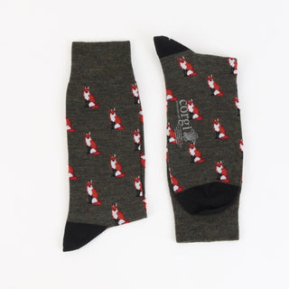 Green merino wool socks with sitting fox motif pattern