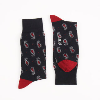 Navy socks with red accents and paisley pattern on a white background