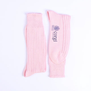 Pair of pink crew length socks with 'Corgi' branding on a white background