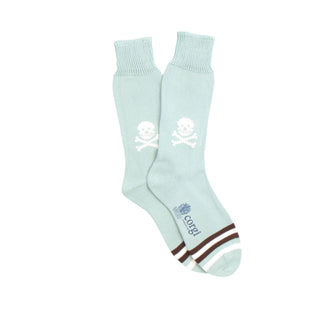 Light aqua socks with skull and crossbones design on a white background