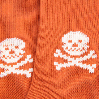 Orange socks with white skull and crossbones pattern