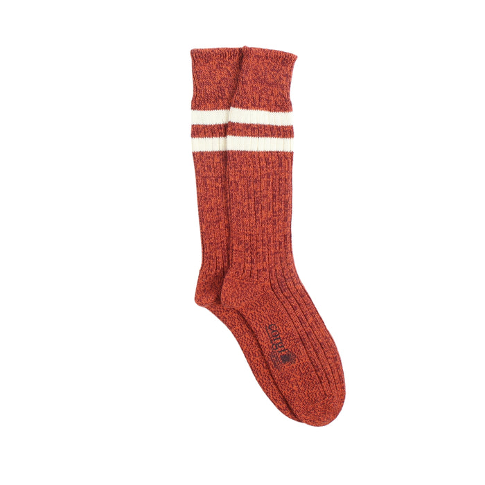 Red sock with white stripes on a white background