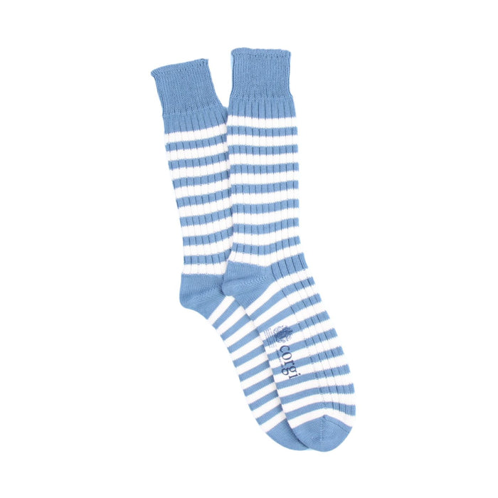 Pair of blue and white striped socks on a white background