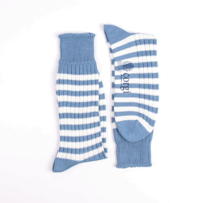 Pair of blue and white striped socks on a white background