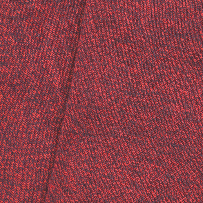 Close-up of red and black marl pattern fabric