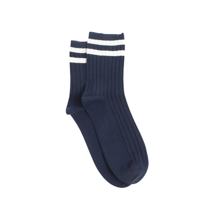 Navy blue socks with two finer white stripes on the top section of the sock photographed on a white background