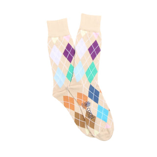 Pair of argyle pattern socks in neutral shades on a white background