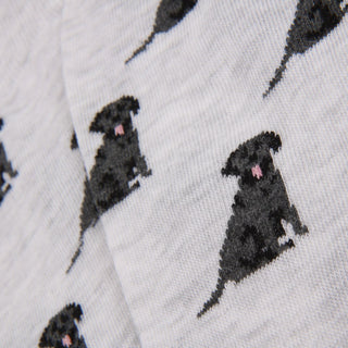 Pattern of black Labrador dogs on a grey background