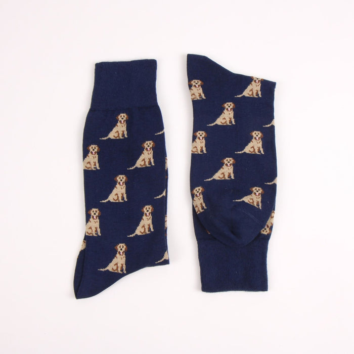 Navy blue socks with Labrador dog pattern photographed on a white background