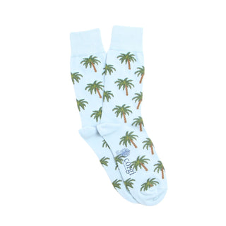 Light blue socks with palm tree pattern on a white background