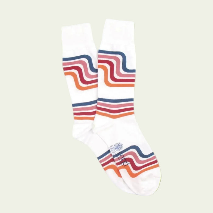 White sock with colorful wavy stripes on a bluebackground
