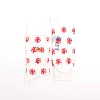 White socks with red dragon patterns and a visible brand logo on a white background