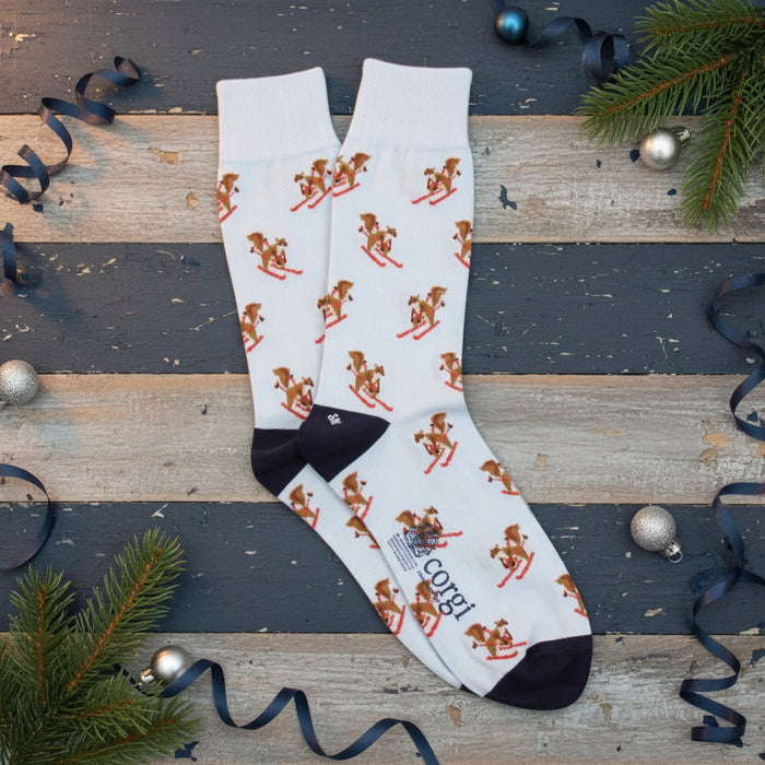 Pale blue socks with skiing squirrel pattern on a white background