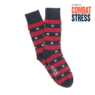 Red and navy striped socks with star pattern on a white background, supporting Combat Stress.