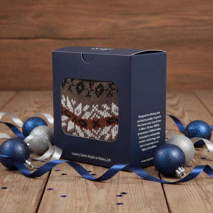Box of luxury socks with a patterned sock on a white background