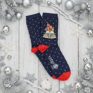 Navy blue socks with white polka dots, red bow, and vintage car design on a white background