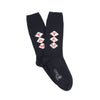 A pair of navy blue cashmere socks with a monogram pattern.