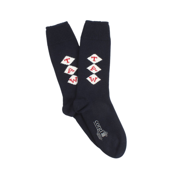 A pair of navy blue cashmere socks with a monogram pattern.