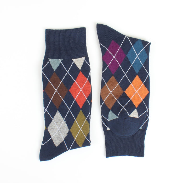 Pair of argyle pattern socks on a white background