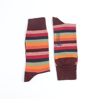 Colourful mix of red striped socks with port cuffs, heel and toe photographed on a white background