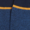 Close-up of blue socks with a yellow trim