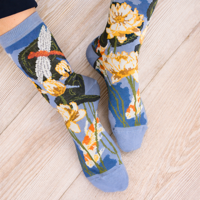 Socks with floral design on a wooden floor