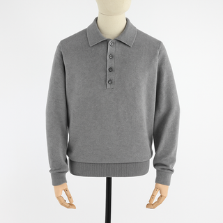 Gray sweater with button collar on a mannequin against a white background