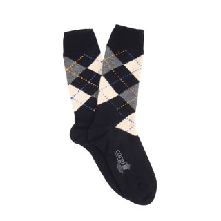 Navy argyle patterned sock on a white background