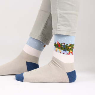 Men's Cotton Socks with an image of three men carrying a large Christmas tree in the snow